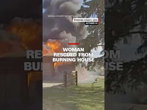 Woman rescued from burning house