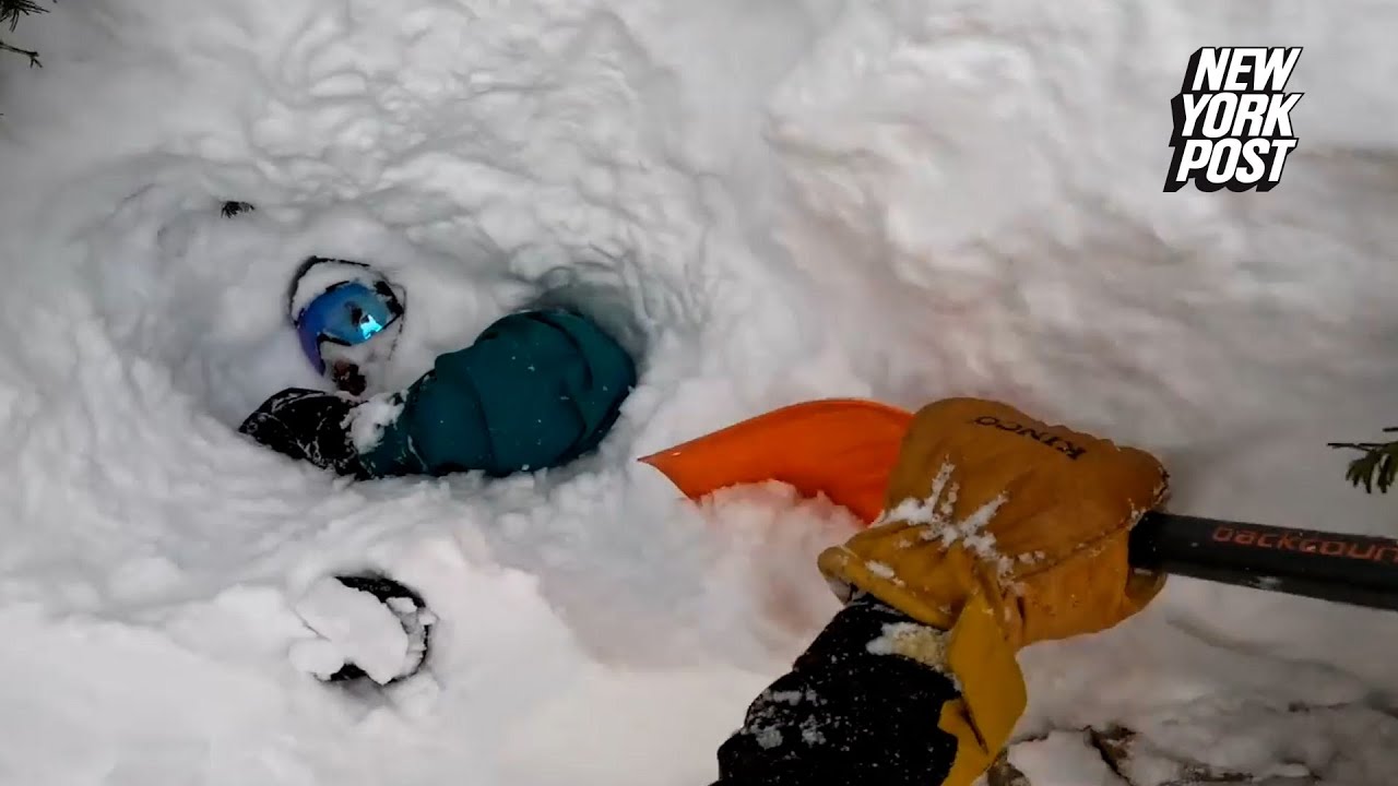Dramatic rescue of snowboarder buried headfirst in snow caught on video | New York Post