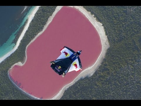 Wingsuit flying over a pink lake in Australia - UCblfuW_4rakIf2h6aqANefA