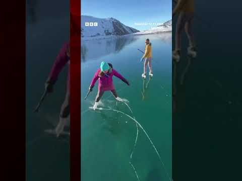 An ice rescue instructor and his wife skated on a rare 'ice-window' in Alaska. #IceSkating #BBCNews