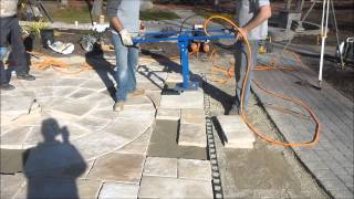 Suction pads for store paving slabs