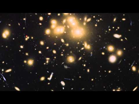 Massive Galaxy Cluster Warps Space, Reveals Whats Behind It | Video - UCVTomc35agH1SM6kCKzwW_g