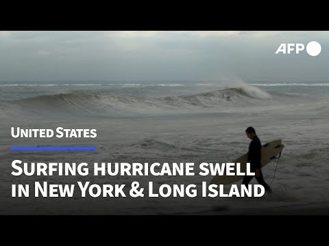 Surfers take advantage of swell caused by Hurricane Erin | AFP
