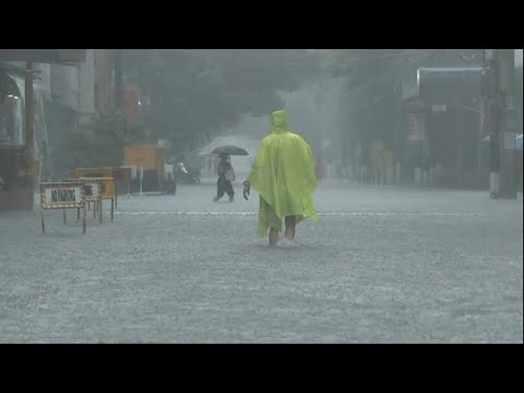 Philippines flooding displaces thousands, two missing | AFP