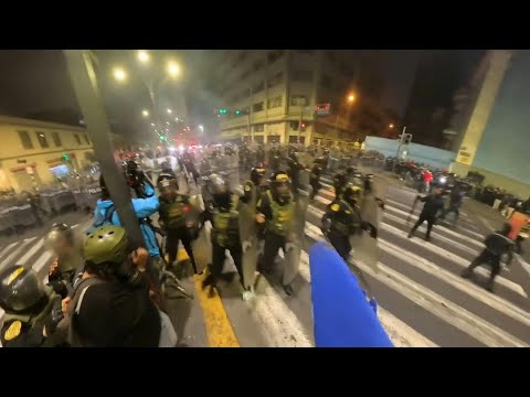 Police charge during Lima anti-government protest that left 30 injured | AFP