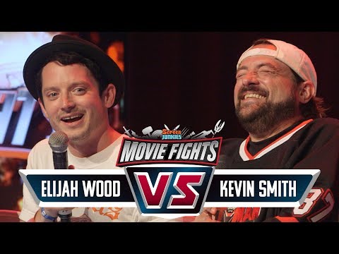 Kevin Smith vs Elijah Wood! - CELEBRITY MOVIE FIGHTS LIVE! - UCOpcACMWblDls9Z6GERVi1A