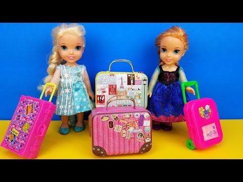 Vacation packing ! Elsa and Anna toddlers - shopping for luggage - suitcases - Barbie is the seller - UCQ00zWTLrgRQJUb8MHQg21A