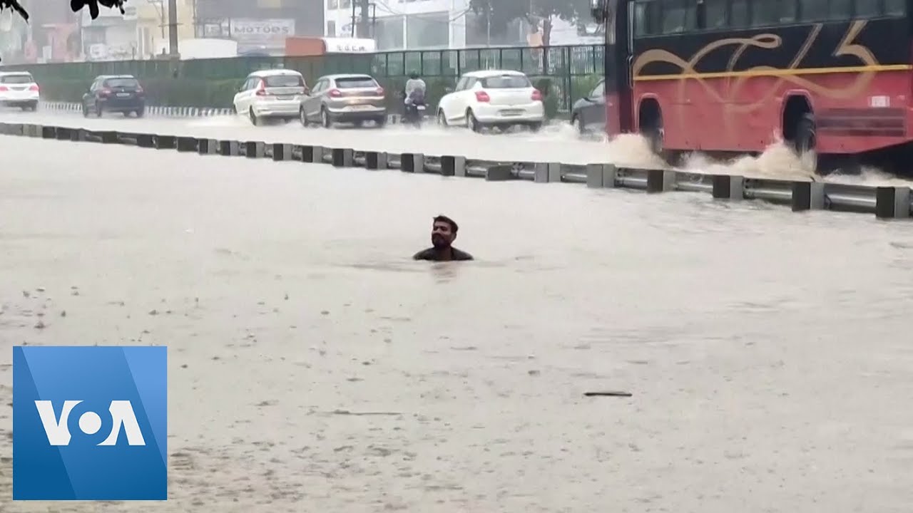 Road Turns Into ‘Swimming Pool’ as Rains Batter India