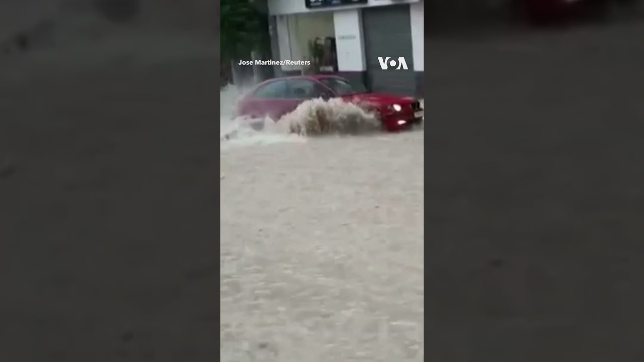Driver Swept Away by Floodwaters in Spain #shorts | VOA News