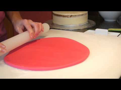 Covering A Cake With Sugarpaste - Cake Craft World Video 3 - UC7aC5_knMDwjINCqaiDURmw