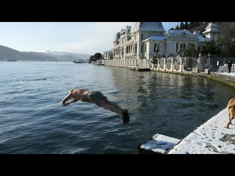 'Like an antidepressant': People swim in Istanbul's Bosphorus on a snowy day | AFP