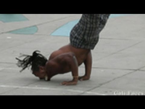 Guy Flips Over 7 People & Stands On His Face - Street Performers