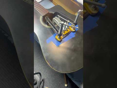 Bridge reattached to Canadian handmade Art & Lutherie guitar