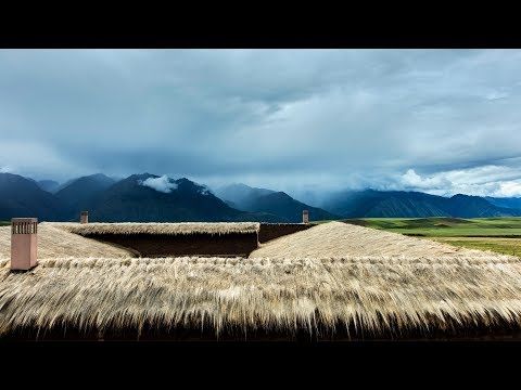 Fraying grass roof tops Mil Centro restaurant in Peru's historical Sacred Valley