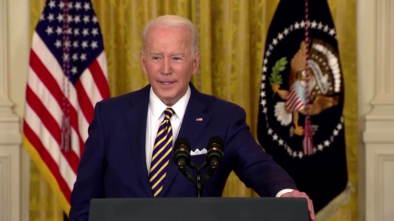 Biden defends first year record as approval sags