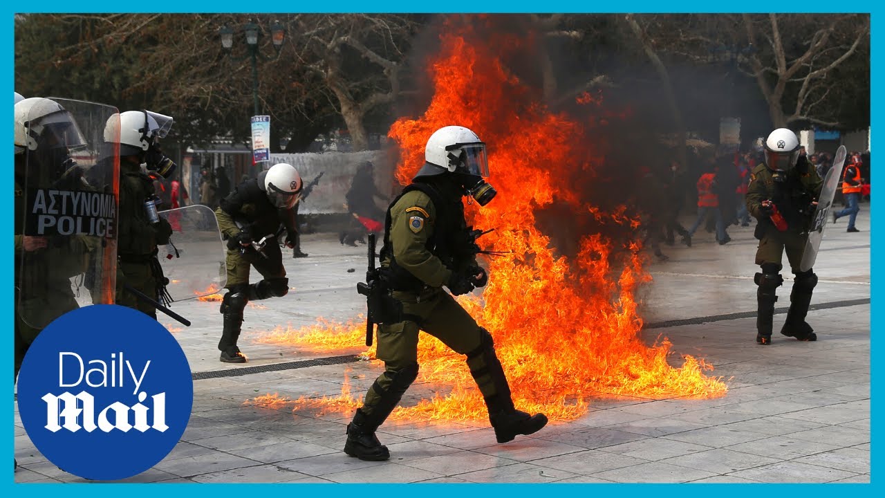 Athens, Greece: Riot police clash with protestors following rail disaster
